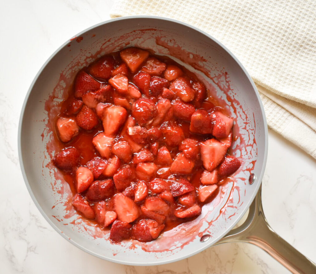 strawberry cooking down in a sautee pan