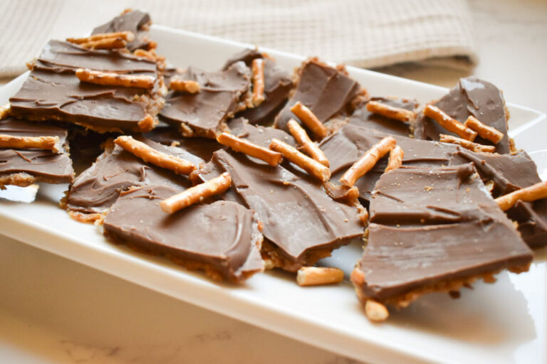 chocolate and peanut butter date bark topped with pretzels