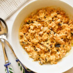chicken salad made with curry spice, raisins, and celery