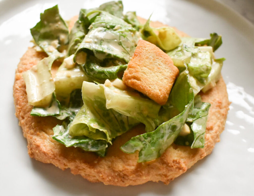 caesar salad on a keto chicken crust