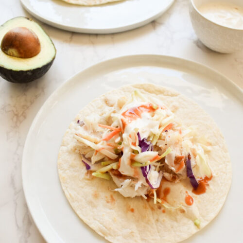 fish tacos made with cod and cabbage slaw