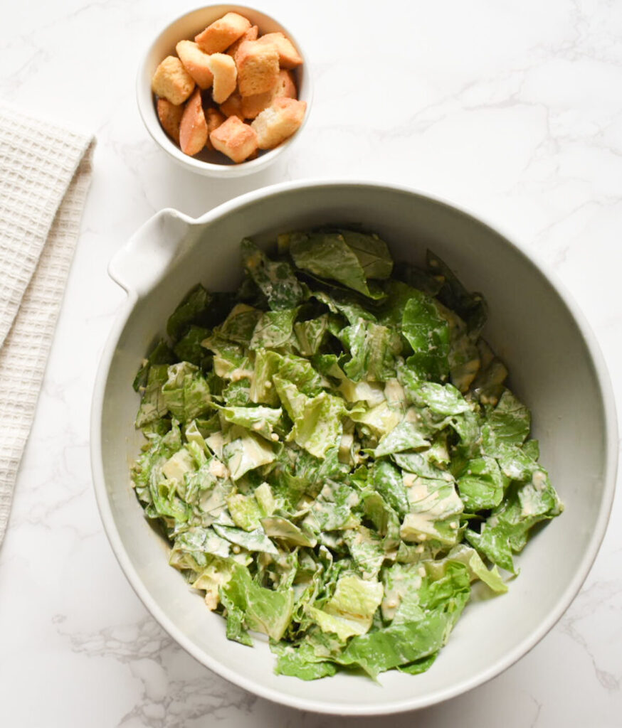 caesar salad tossed with homemade dressing