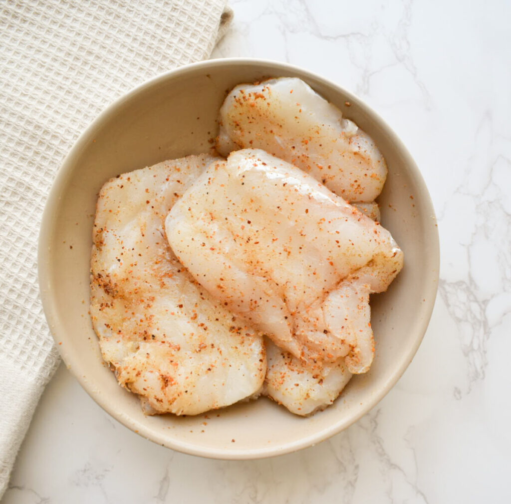 seasoned cod ready to be cooked