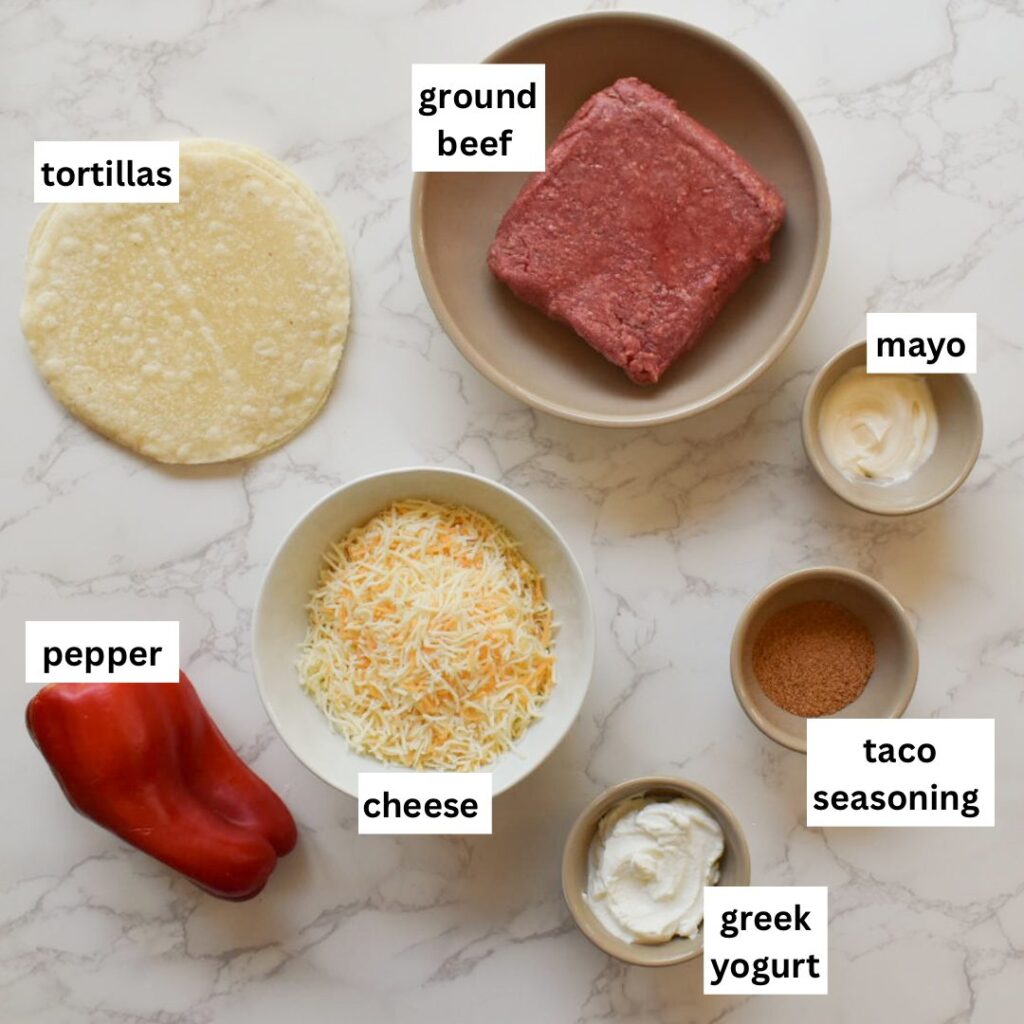 ingredients in baked tacos made with ground beef and cheese