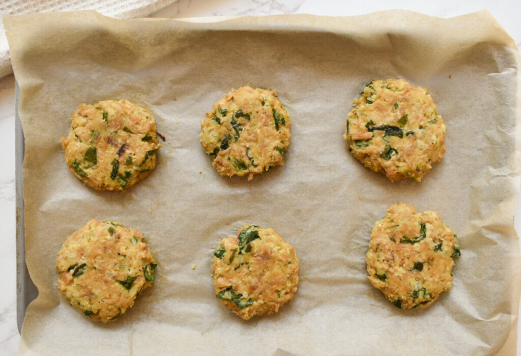 tuna patties on baking sheet ready to be baked