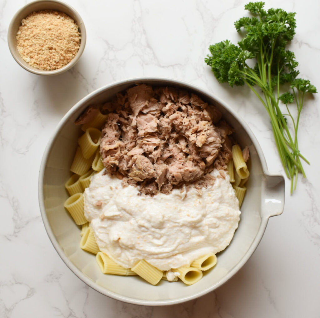 tuna, cottage cheese sauce, and noodles ready to be combined for tuna pasta bake