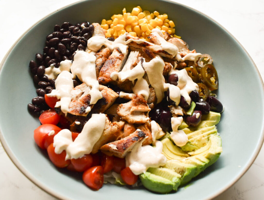 southwest chicken burrito bowl with beans and corn