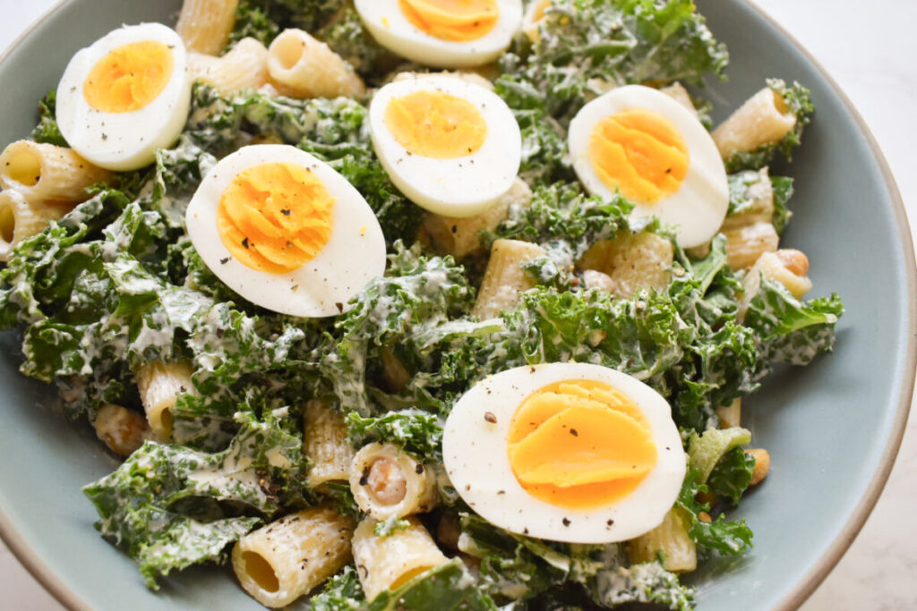 hard boiled eggs on a kale caesar salad