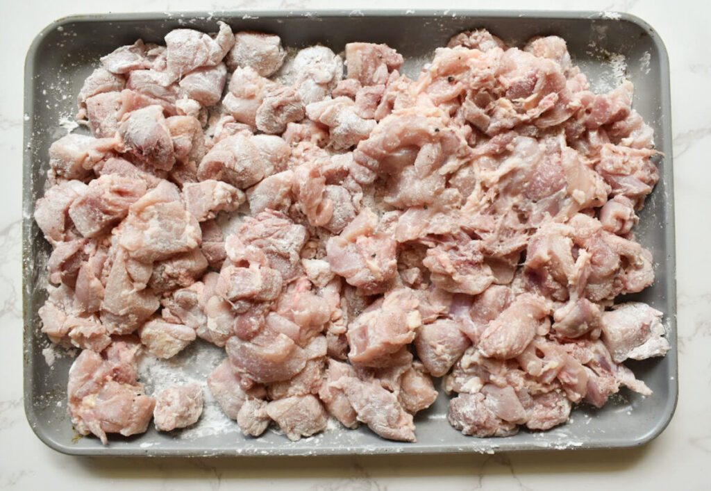 chicken thigh pieces coated in cornstarch