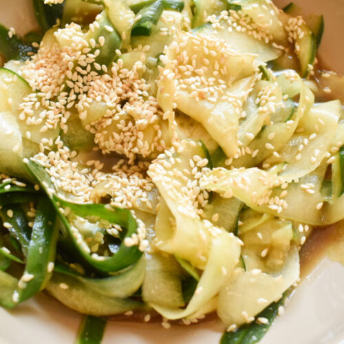 cucumber ribbon salad topped with sesame seeds