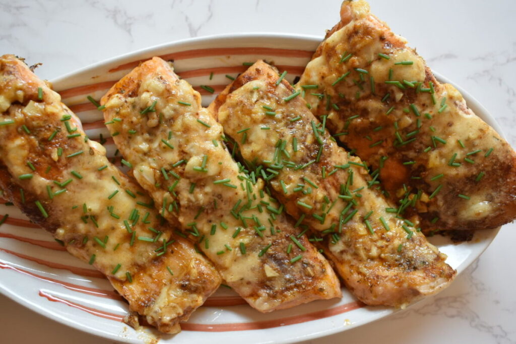 prepared salmon topped with spices and garlic lime mayo