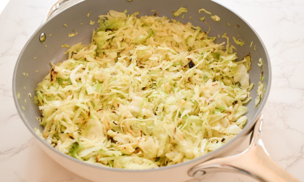 freshly coked green cabbage with garlic and olive oil