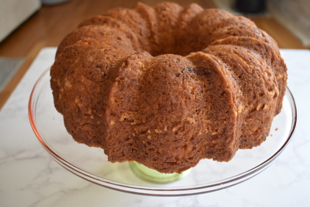 freshly baked honey apple cake ready to be iced