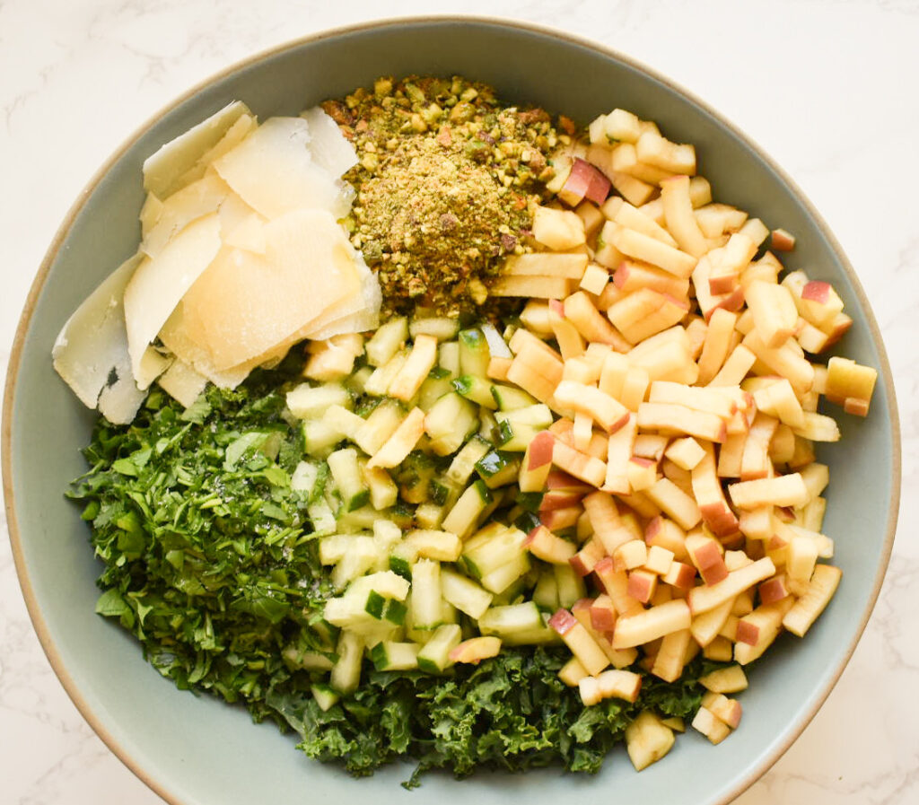 kale salad ingredients ready to be tossed