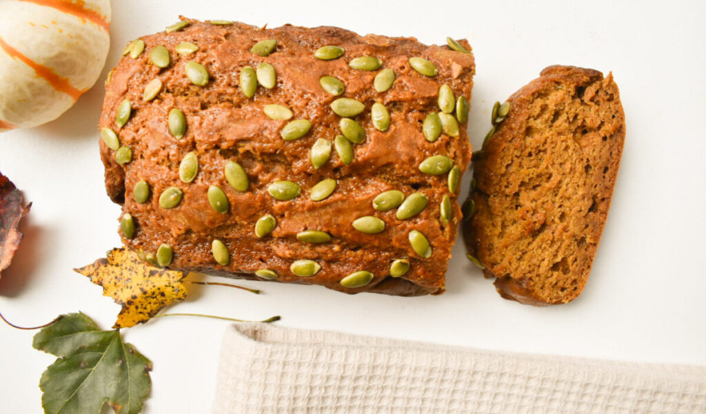 one bowl pumpkin bread topped with pepitas