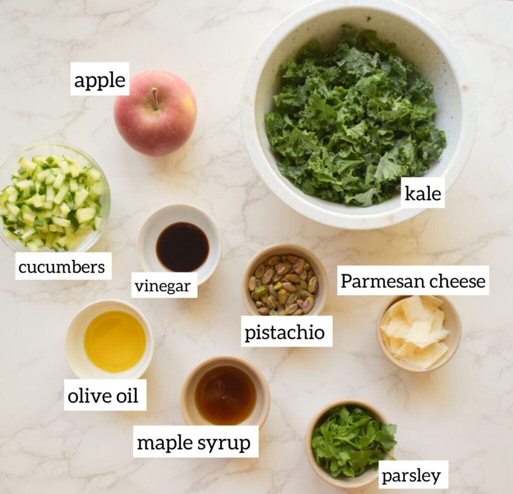 ingredients in kale salad with apples, cucumber and pistachio