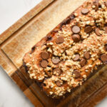 peanut butter banana bread topped with chopped peanuts