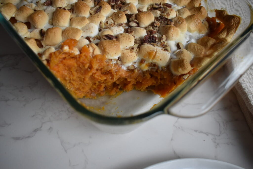 Toasted marshmallows and pecans on top of sweet potato mash