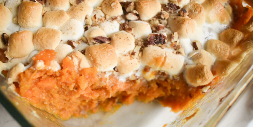 Sweet potato casserole with marshmallow topping in a baking dish