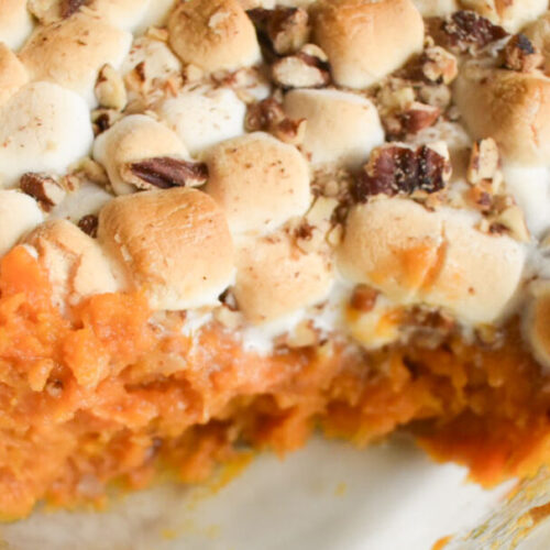 Sweet potato casserole with marshmallow topping in a baking dish
