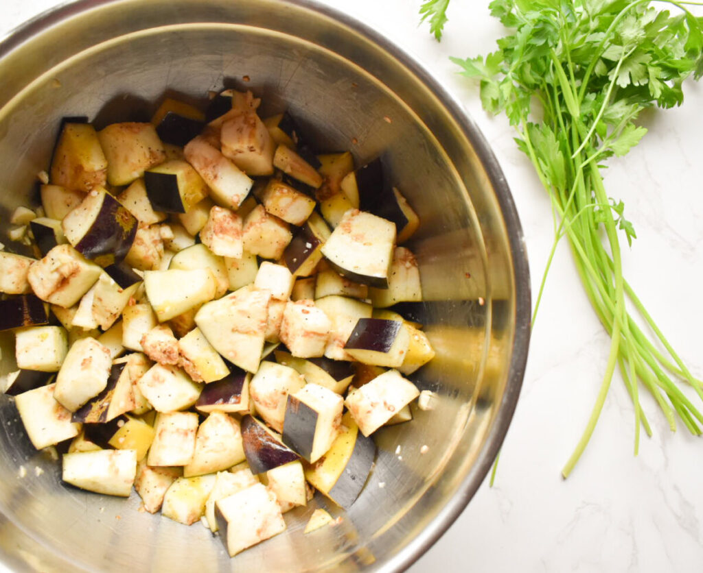 Cubed eggplant tossed with olive oil and garlic