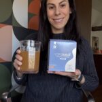 woman with prenatal vitamin powder prepared