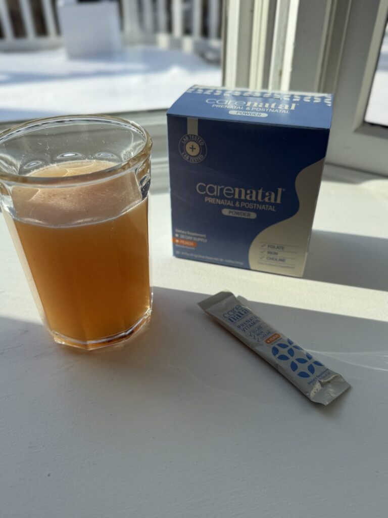 prenatal vitamin powder with packet, box, and mixed drink