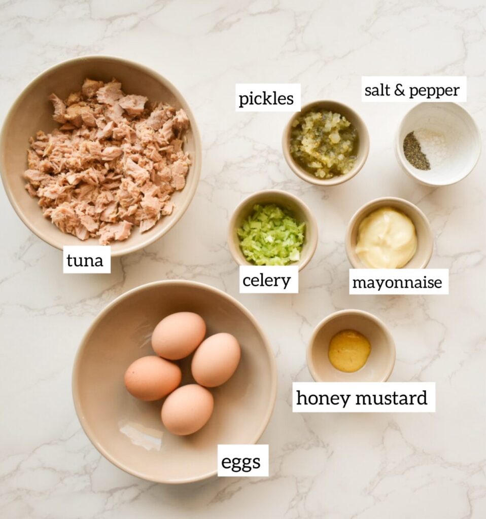 ingredients for creamy tuna egg salad with eggs and celery