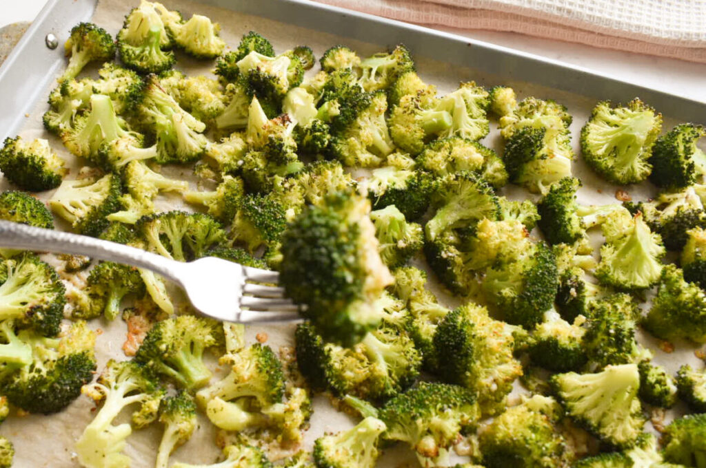 Close-up of oven roasted broccoli with parmesan and lemon
