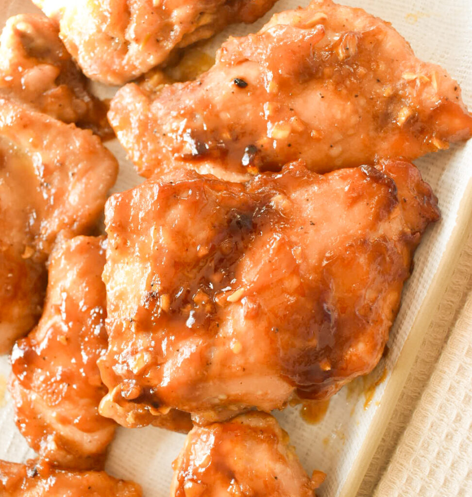 Close-up of caramelized honey garlic chicken with glossy sauce