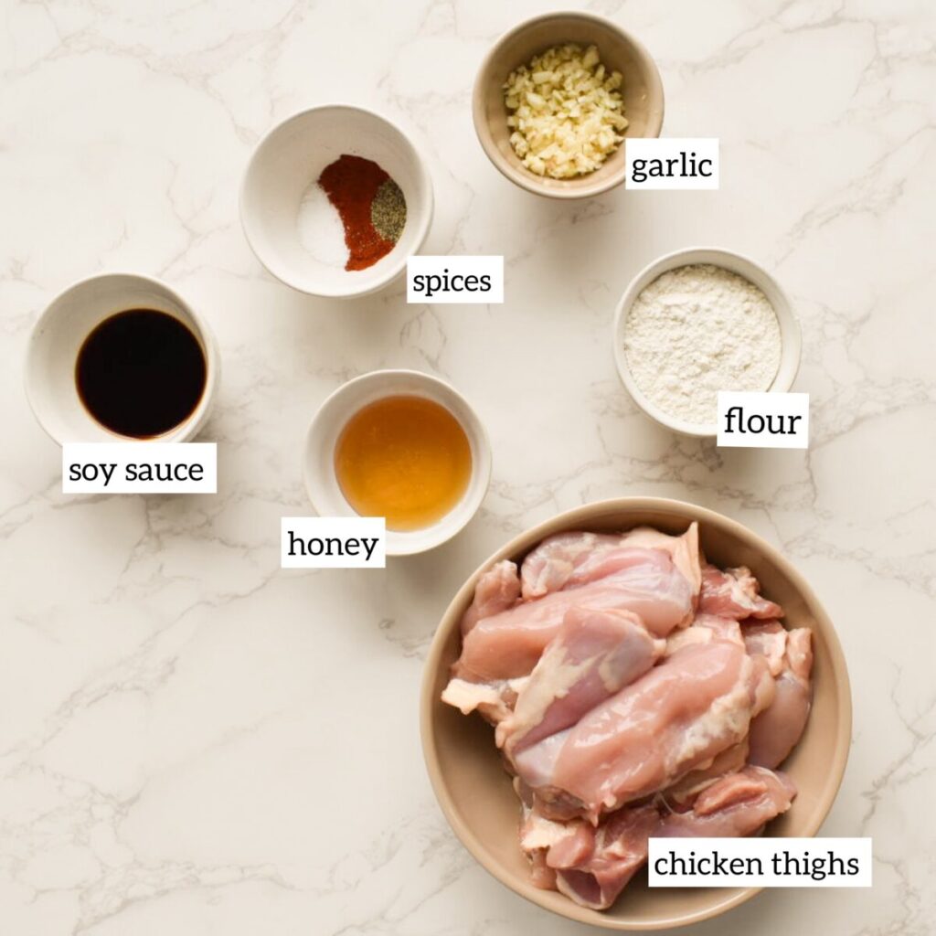 Ingredients in oven baked chicken thighs with garlic and soy glaze