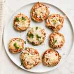 Crispy air fryer eggplant parmesan slices topped with melted cheese