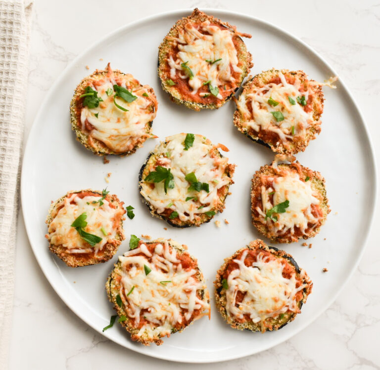 Crispy air fryer eggplant parmesan slices topped with melted cheese