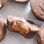 Layered chocolate peanut butter cups showing cross section