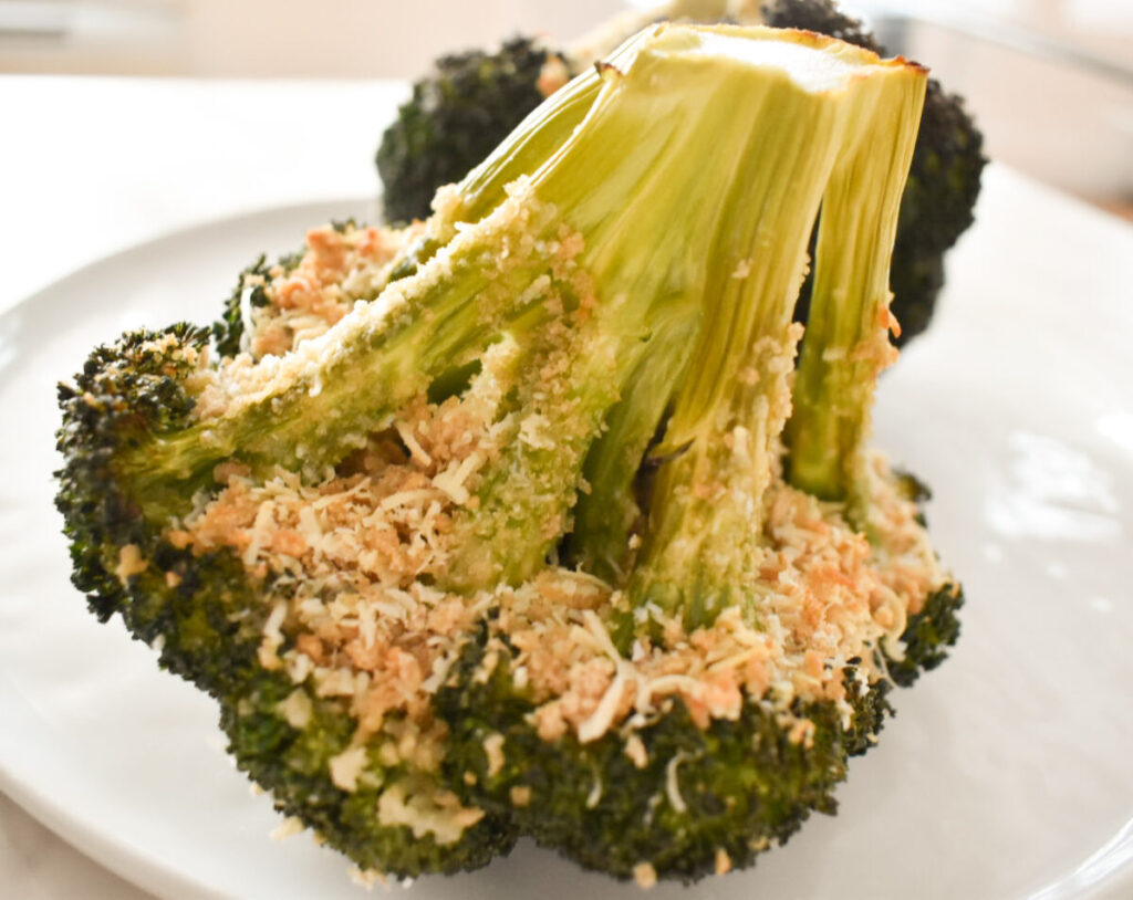 Close-up of cheesy garlic breadcrumb topping on broccoli