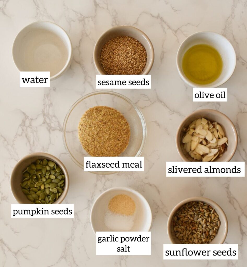 Ingredients in Healthy homemade gluten-free seed crackers cooling on baking sheet