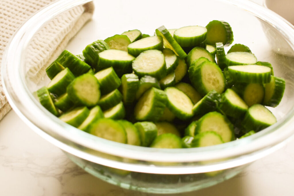 Close-up of crunchy baby cucumber salad with sesame ginger dressing