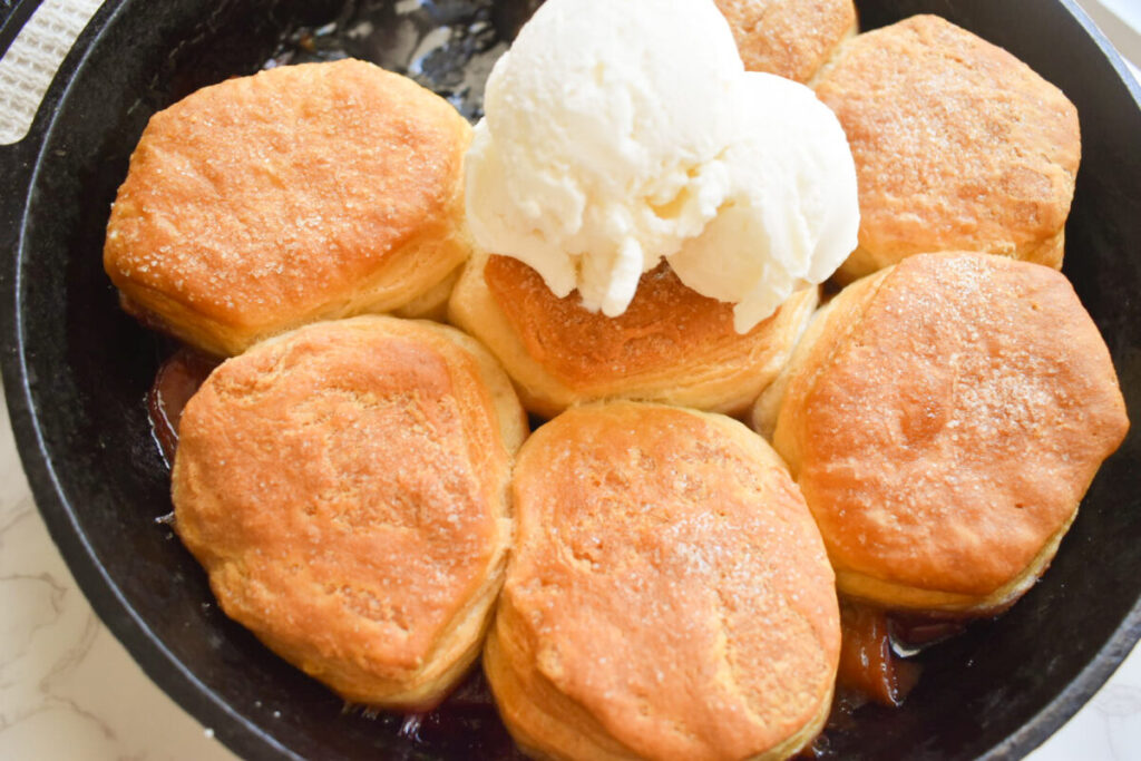 Homemade peach cobbler served with ice cream