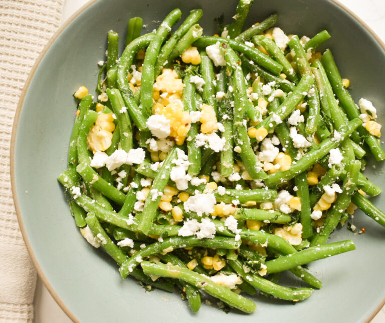Fresh green bean salad with sweet corn, feta cheese, and lemon dressing