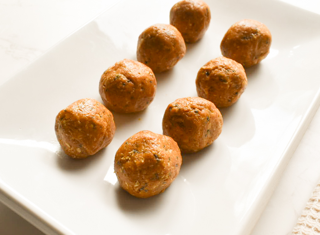 Pumpkin peanut butter energy balls on a plate