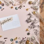 An elegant September calendar surrounded by dried flowers and decorative elements, offering ample copy space.